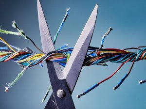 Firefly Big scissors cutting through electric wires isolated